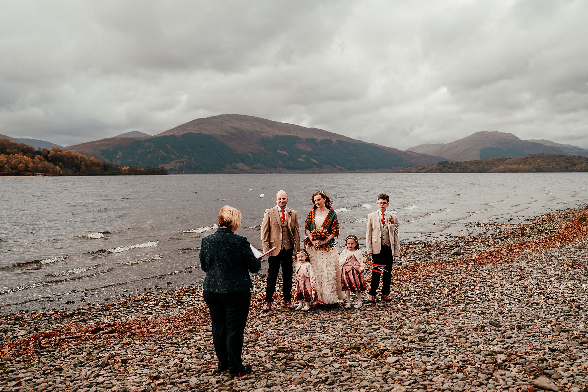 wee wild wedding with children at cashel loch lomond with loch and mountains of scotland in background